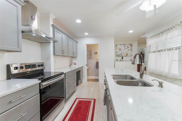 35 Misners Trl, Ormond Beach, FL 32174 - kitchen with electric stove, wall chimney range hood, gray cabinets, and recessed lighting