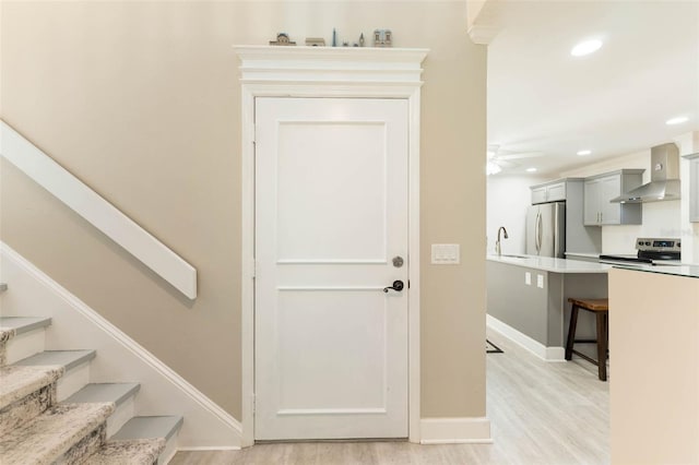 35 Misners Trl, Ormond Beach, FL 32174 - staircase with wood finished floors, recessed lighting, baseboards, and ceiling fan