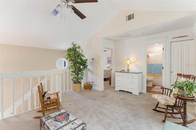 35 Misners Trl, Ormond Beach, FL 32174 - living area with vaulted ceiling, ceiling fan, carpet floors, and an upstairs landing