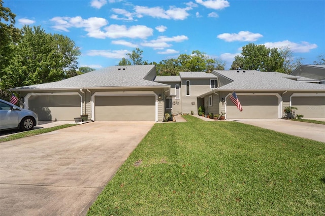 35 Misners Trl, Ormond Beach, FL 32174 - view of front of property featuring concrete driveway, a garage, a front yard, and a shingled roof
