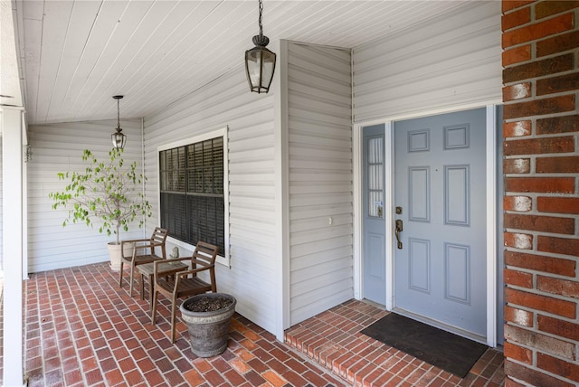 property entrance with covered porch
