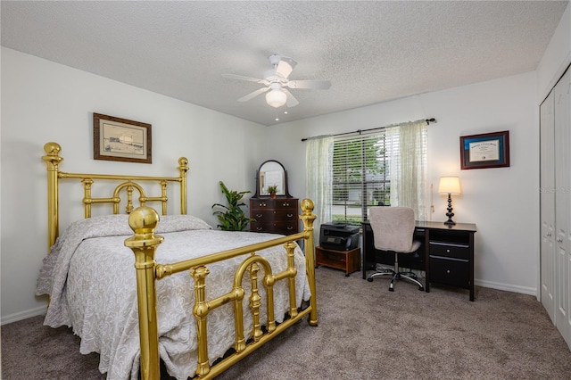 carpeted bedroom featuring baseboards, a ceiling fan, a textured ceiling, and a closet