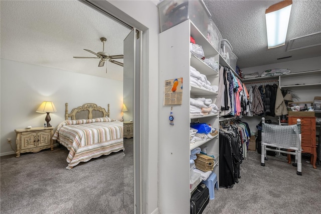 spacious closet with carpet and ceiling fan