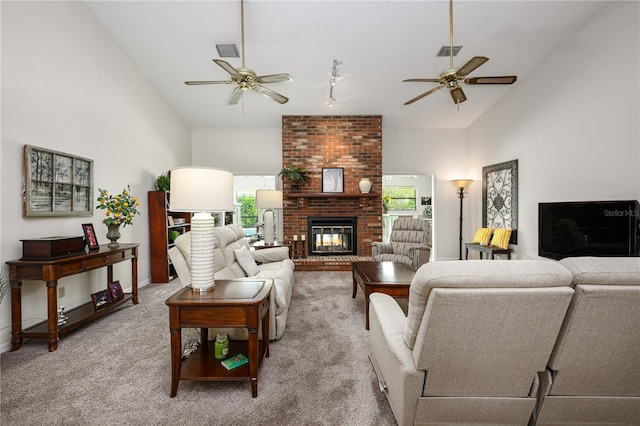 carpeted living area featuring visible vents, high vaulted ceiling, and ceiling fan