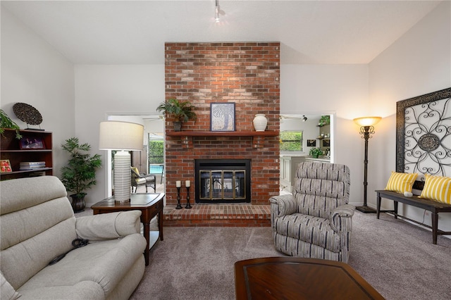 carpeted living area with plenty of natural light and a brick fireplace