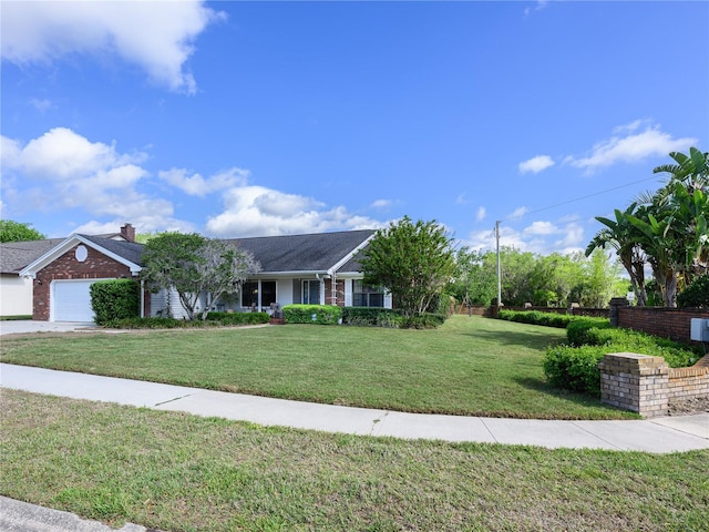 ranch-style house with a front lawn, driveway, and an attached garage