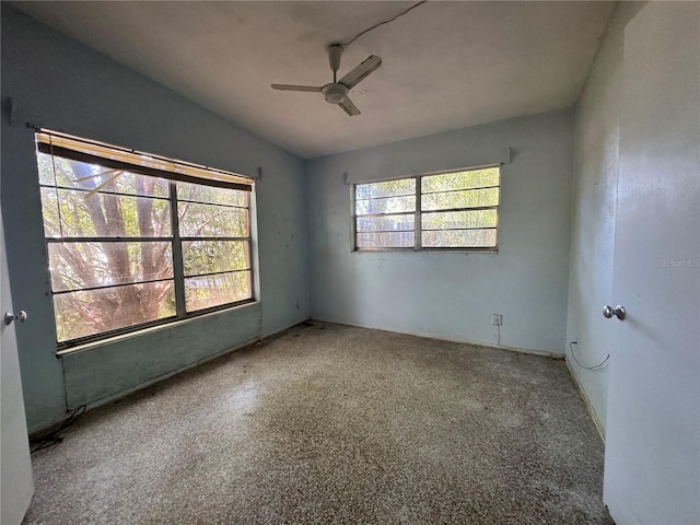 unfurnished room with ceiling fan