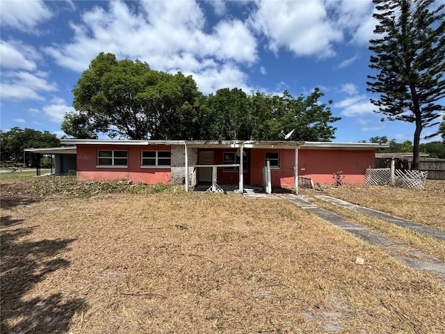 view of front of property featuring fence