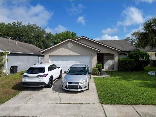 single story home with an attached garage, a front lawn, stucco siding, and concrete driveway