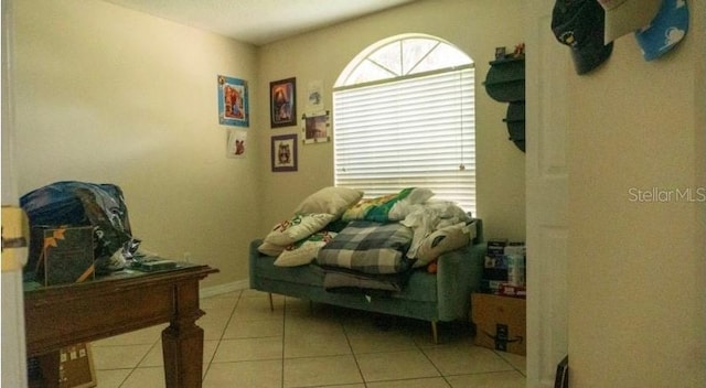 bedroom featuring light tile patterned flooring