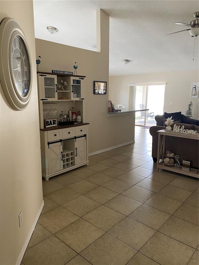 1567 Oak Hill Trl, Kissimmee, FL 34747 - corridor with tile patterned floors, baseboards, and a textured ceiling