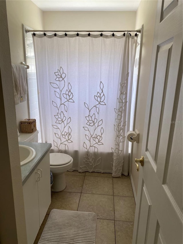 1567 Oak Hill Trl, Kissimmee, FL 34747 - full bathroom featuring tile patterned flooring, vanity, toilet, and shower / bath combination with curtain