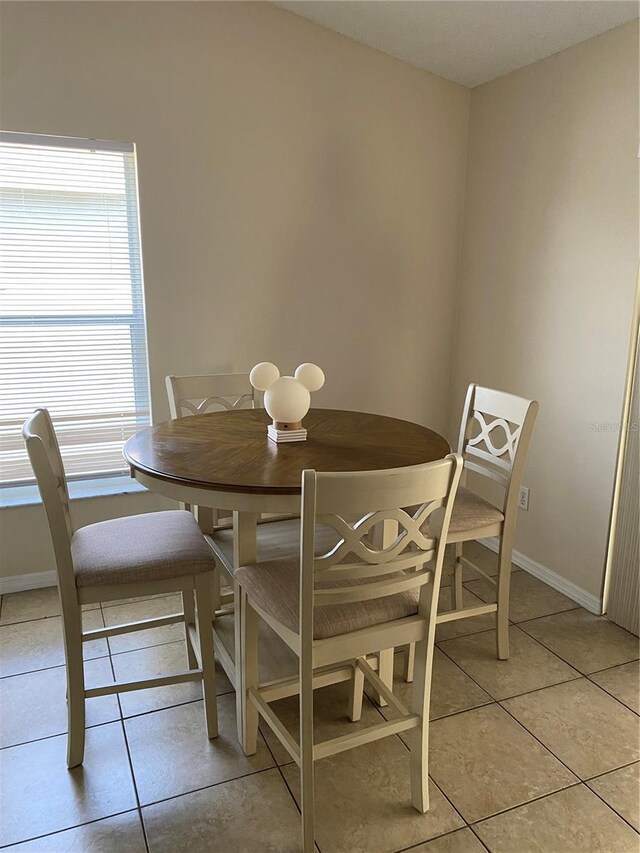 1567 Oak Hill Trl, Kissimmee, FL 34747 - dining room with light tile patterned floors and baseboards