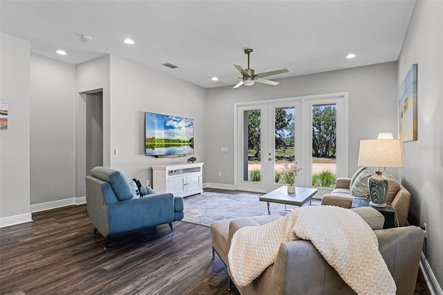 living room with a ceiling fan, french doors, baseboards, dark wood-type flooring, and visible vents