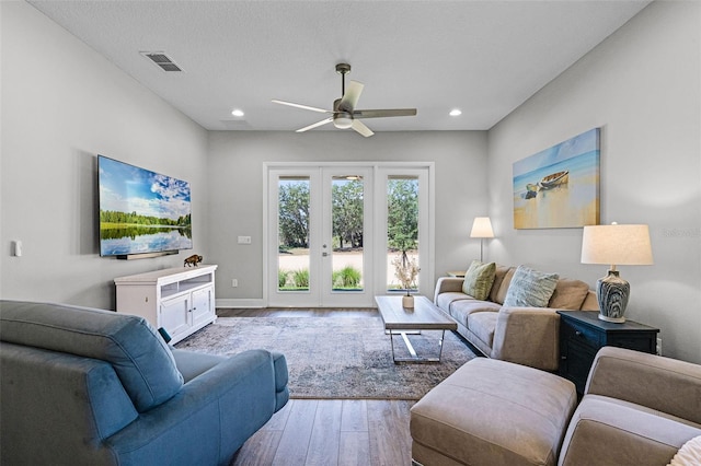 living area with recessed lighting, wood finished floors, visible vents, french doors, and ceiling fan