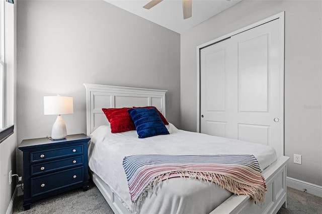 carpeted bedroom featuring a ceiling fan, baseboards, and a closet