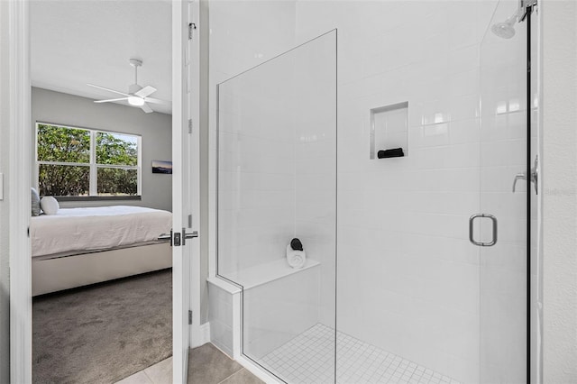 full bath featuring a shower stall, a ceiling fan, ensuite bathroom, and tile patterned floors