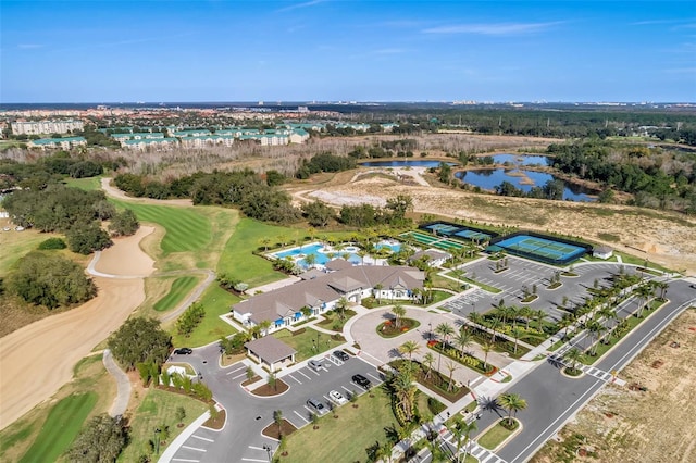 bird's eye view featuring golf course view and a water view