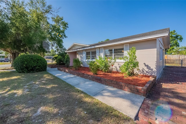 view of front of home with fence