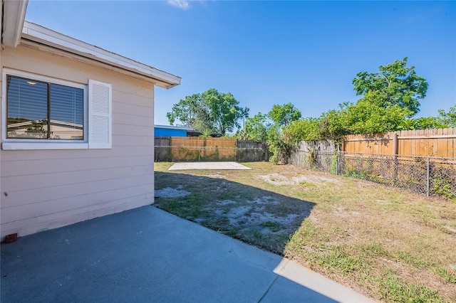 view of yard featuring a patio area and a fenced backyard