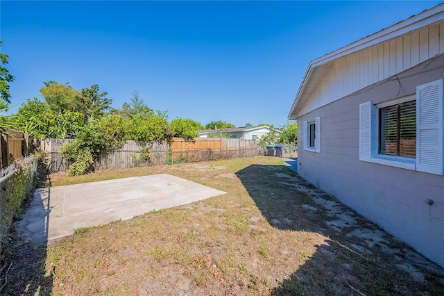 view of yard with a patio area and a fenced backyard