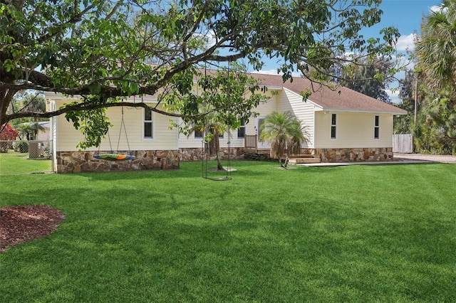 11352 Persimmon Blvd, West Palm Beach, FL 33411 - rear view of house featuring stone siding