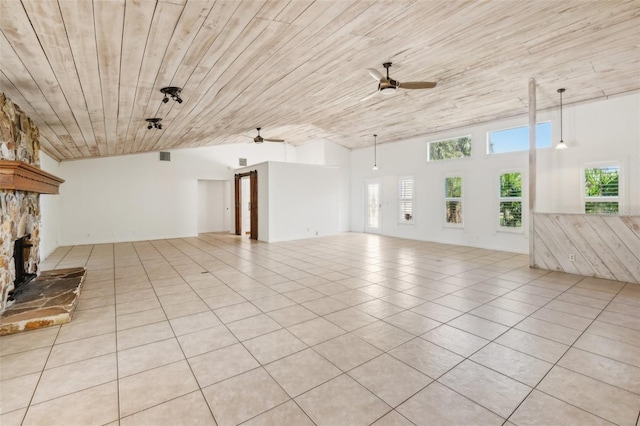 11352 Persimmon Blvd, West Palm Beach, FL 33411 - unfurnished living room with ceiling fan, wood ceiling, lofted ceiling, a stone fireplace, and light tile patterned floors