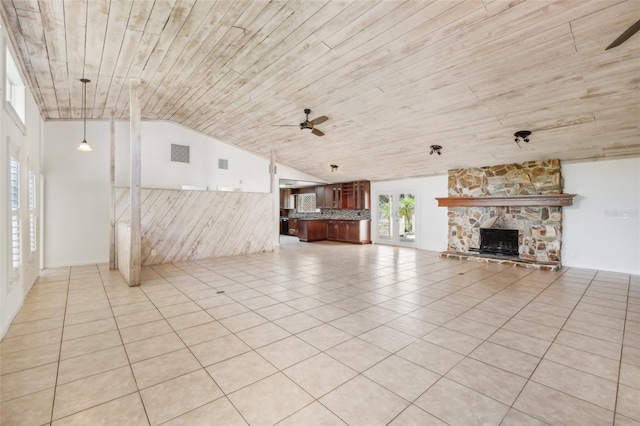 11352 Persimmon Blvd, West Palm Beach, FL 33411 - unfurnished living room featuring a ceiling fan, vaulted ceiling, wood ceiling, a stone fireplace, and light tile patterned floors