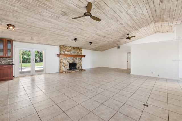 11352 Persimmon Blvd, West Palm Beach, FL 33411 - unfurnished living room with a ceiling fan, wooden ceiling, light tile patterned floors, a fireplace, and vaulted ceiling