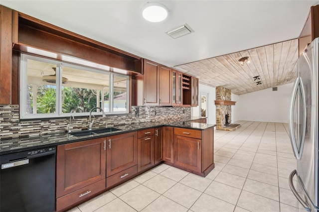 11352 Persimmon Blvd, West Palm Beach, FL 33411 - kitchen featuring dishwasher, a sink, freestanding refrigerator, tasteful backsplash, and light tile patterned floors