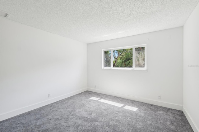 11352 Persimmon Blvd, West Palm Beach, FL 33411 - carpeted spare room with a textured ceiling and baseboards