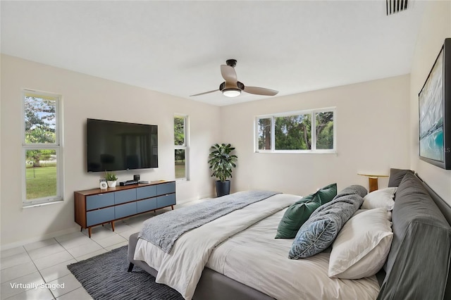 11352 Persimmon Blvd, West Palm Beach, FL 33411 - bedroom with multiple windows, light tile patterned floors, baseboards, and a ceiling fan
