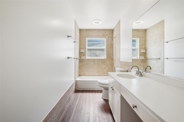 11352 Persimmon Blvd, West Palm Beach, FL 33411 - bathroom featuring toilet, bathtub / shower combination, vanity, wood finished floors, and tile walls