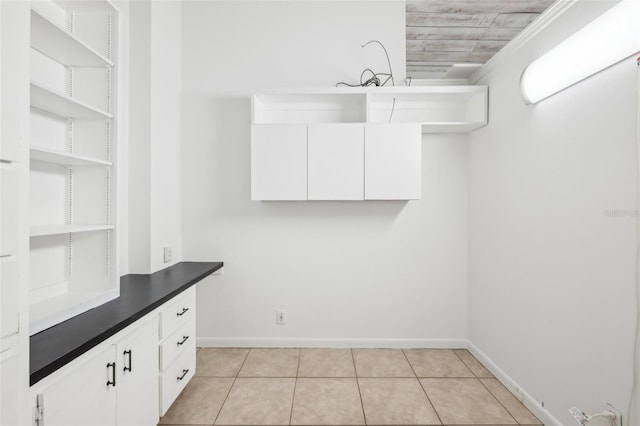 11352 Persimmon Blvd, West Palm Beach, FL 33411 - laundry room featuring baseboards and light tile patterned floors