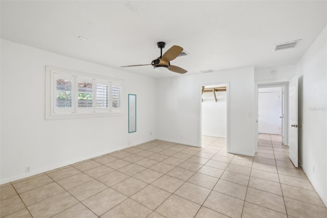 11352 Persimmon Blvd, West Palm Beach, FL 33411 - unfurnished bedroom with a ceiling fan, light tile patterned floors, a spacious closet, and a closet