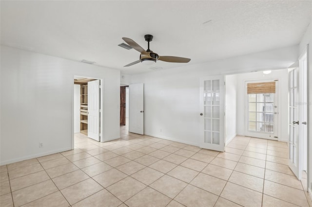 11352 Persimmon Blvd, West Palm Beach, FL 33411 - spare room featuring light tile patterned flooring, ceiling fan, and baseboards