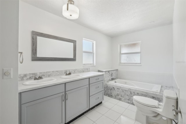 11352 Persimmon Blvd, West Palm Beach, FL 33411 - full bath featuring toilet, a bath, double vanity, tile patterned floors, and a textured ceiling