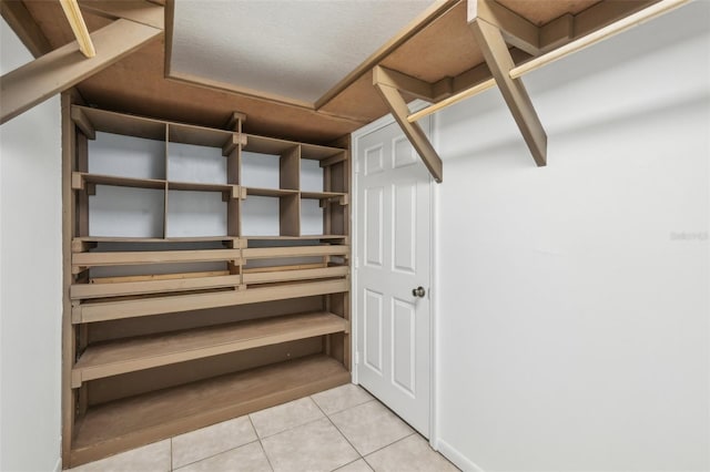 11352 Persimmon Blvd, West Palm Beach, FL 33411 - walk in closet featuring tile patterned floors