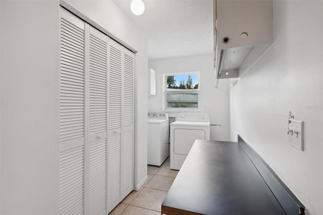 11352 Persimmon Blvd, West Palm Beach, FL 33411 - laundry room featuring independent washer and dryer, light tile patterned floors, and a textured ceiling