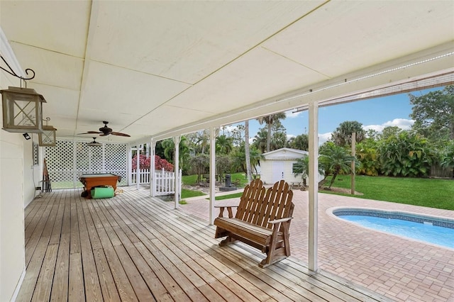 11352 Persimmon Blvd, West Palm Beach, FL 33411 - wooden deck featuring a ceiling fan, an outdoor pool, a lawn, and a patio area