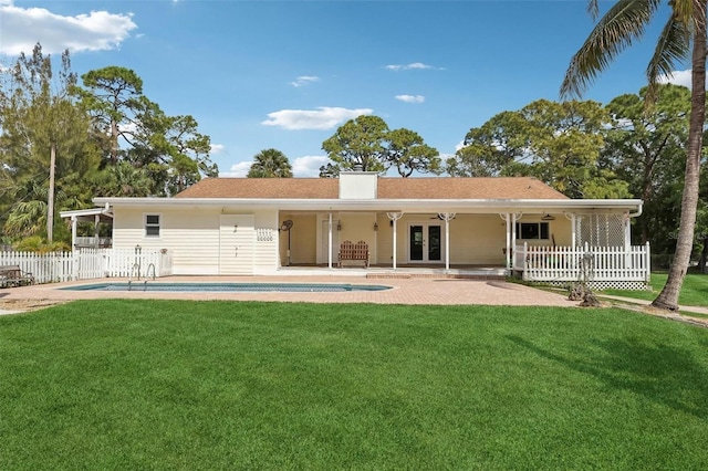 11352 Persimmon Blvd, West Palm Beach, FL 33411 - back of house featuring french doors, a chimney, a patio area, and ceiling fan