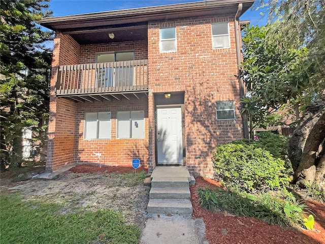 5126 Picadilly Circus Ct Unit 11, Orlando, FL 32839 - view of front of property featuring brick siding and a balcony