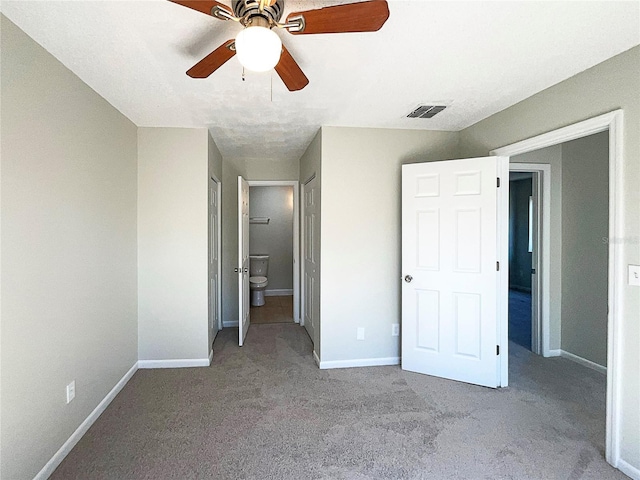 5126 Picadilly Circus Ct Unit 11, Orlando, FL 32839 - unfurnished bedroom featuring a ceiling fan, baseboards, carpet, and visible vents
