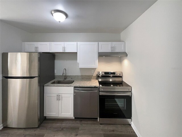 5126 Picadilly Circus Ct Unit 11, Orlando, FL 32839 - kitchen with a sink, white cabinetry, under cabinet range hood, and stainless steel appliances