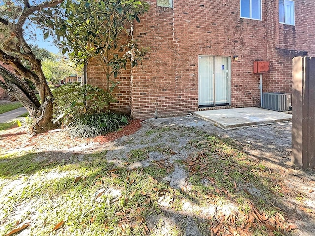 5126 Picadilly Circus Ct Unit 11, Orlando, FL 32839 - exterior space with central AC and brick siding