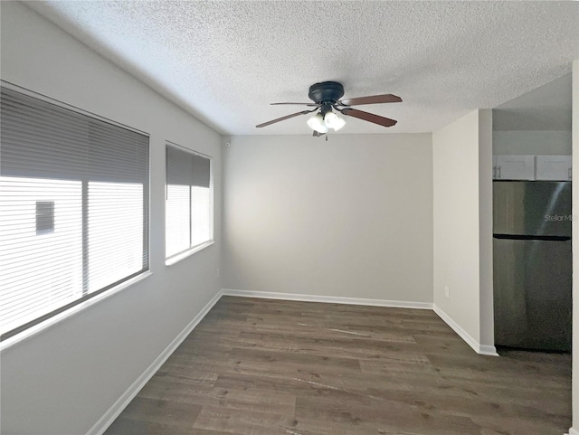 5126 Picadilly Circus Ct Unit 11, Orlando, FL 32839 - spare room featuring baseboards, a textured ceiling, a ceiling fan, and wood finished floors