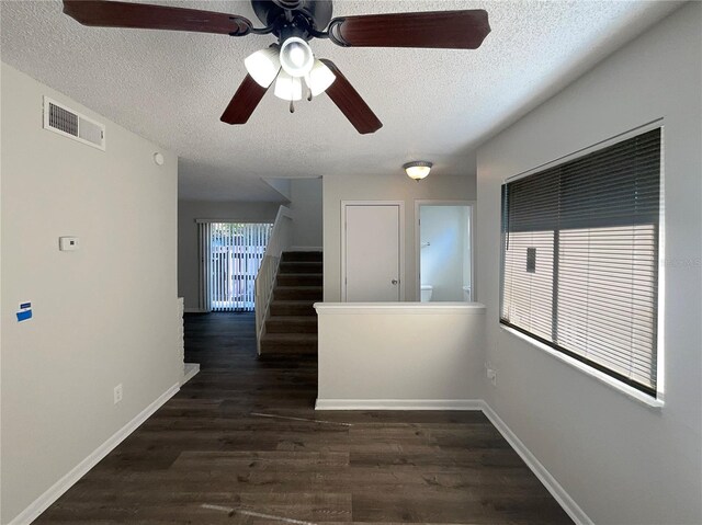 5126 Picadilly Circus Ct Unit 11, Orlando, FL 32839 - spare room with dark wood-style flooring, visible vents, ceiling fan, and a textured ceiling