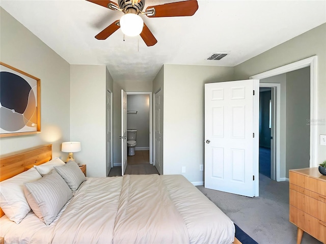 5126 Picadilly Circus Ct Unit 11, Orlando, FL 32839 - carpeted bedroom with ensuite bath, visible vents, baseboards, and ceiling fan
