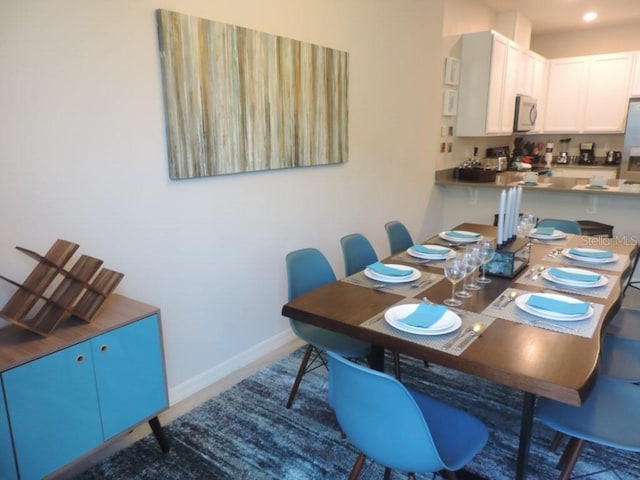 dining space with baseboards