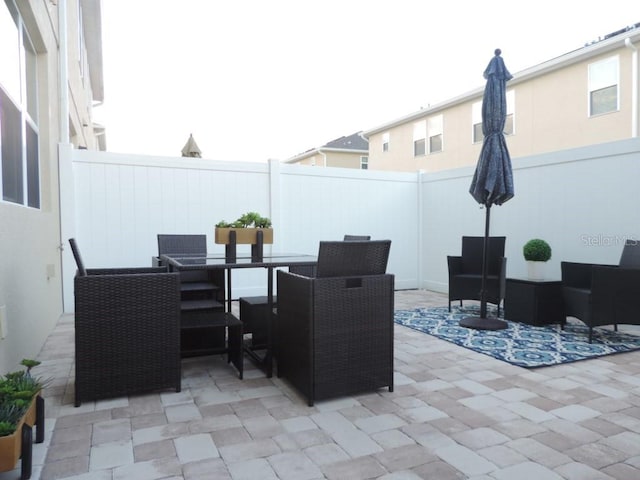 view of patio / terrace with outdoor dining space and a fenced backyard